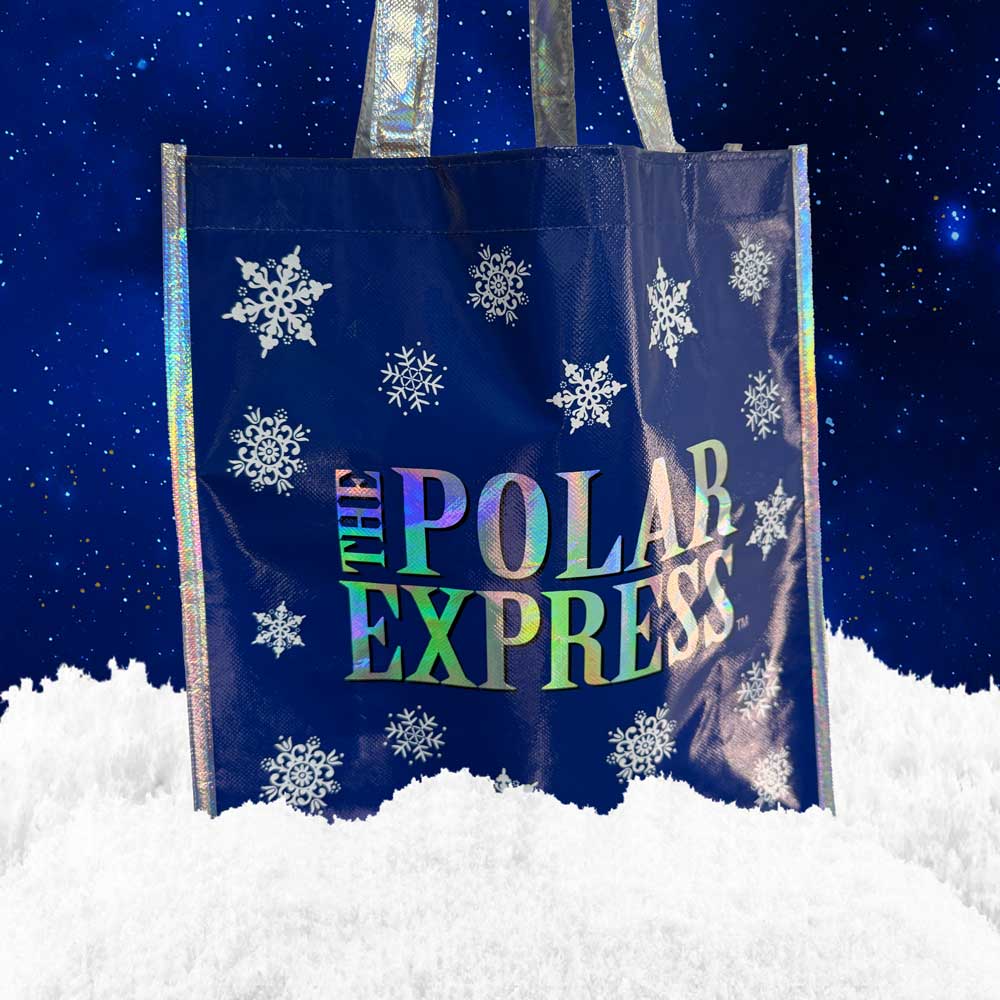 The Polar Express blue holographic tote bag with snowflakes and reflective logo.